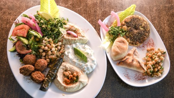 Vegos don't get off lightly: the vegetarian platter with cheese and spinach breads, zaatar 'pizza', chickpea salads, pickles, roasted cauliflower, tahini, dips, vine leaves and falafel.