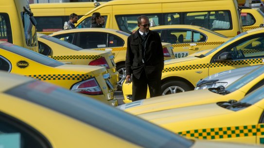 MELBOURNE, AUSTRALIA - AUGUST 24:  Taxi drivers are seen biding their time  as they wait their turn at the Taxi Holding Area at Melbourne Airport on August 24, 2015 in Melbourne, Australia.  (Photo by Jesse Marlow/Fairfax Media) Generic taxis; taxi cabs.