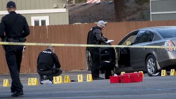 Coeur d'Alene police investigate the scene where pastor Tim Remington was shot.