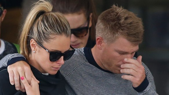 David Warner, accompanied by his wife Candice Falzon cries as he leaves the hospital on Thursday. 