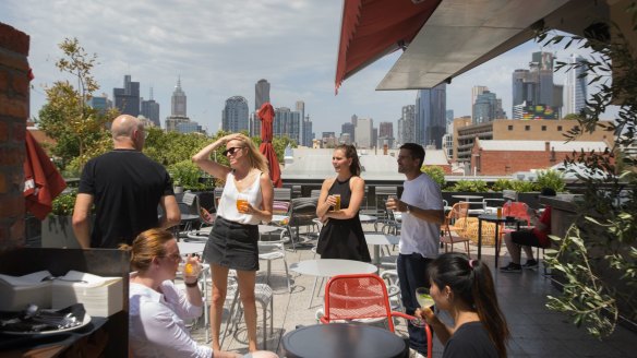 Modern day clubhouse: From the rooftop at Johnny's Green Room, city skyscrapers look close enough to touch.