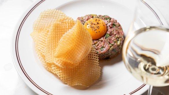 Steak tartare with waffle-like gaufrette crisps.