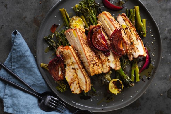 Neil Perry's roast pork belly with braised dark greens.