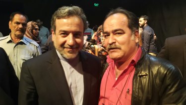Iran's Deputy Foreign Minister Abbas Araghchi (left) with Hossein Babaahmadi, held in 2013 on Manus Island.