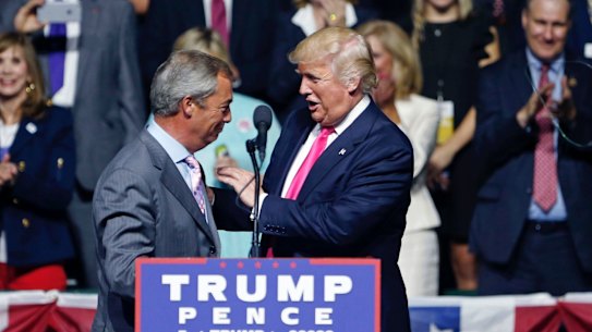 Donald Trump welcomes Nigel Farage to the stage.