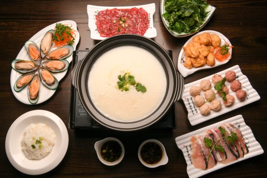 Shunde-style porridge base hotpot with seafood, sliced beef and delicate fish and pork balls. 