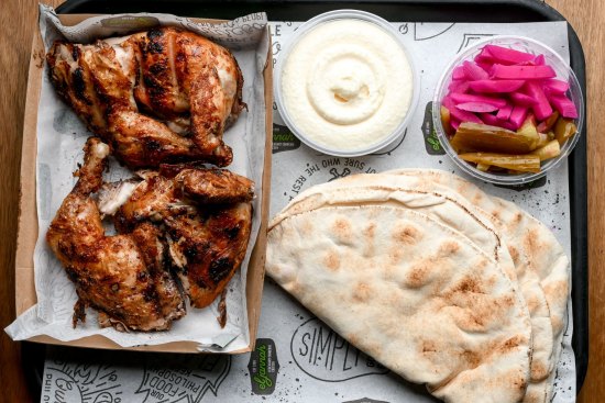 Whole chicken plate with pickles, pita and toum (tangy garlic sauce).