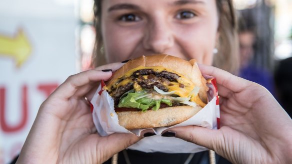 The burger, held here by unofficial burger model Lauren Clements.