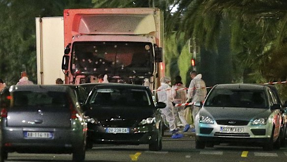 Police surround the truck that slammed into a Bastille Day crowd in Nice on Thursday.