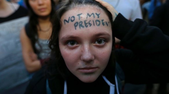 Clair Sheehan has the words "Not My President" written on her forehead as she takes part in a protest in Seattle.