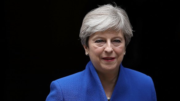 Prime Minister Theresa May leaves Downing Street to go to Buckingham Palace for the Queen's permission to form a UK government.