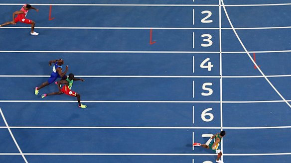 Wayde van Niekerk, right, obliterates the field in the men's 400m.