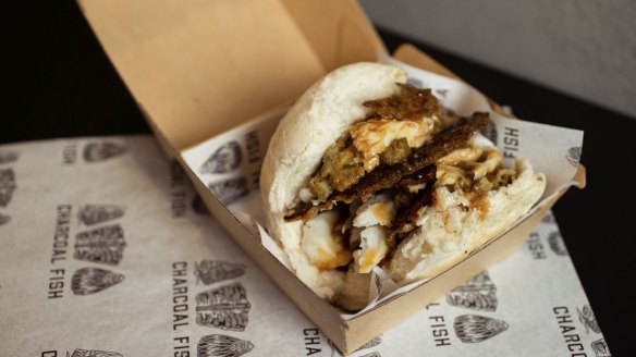 Rolls with Murray cod, gravy, skin and stuffing are served at Josh Niland's Charcoal Fish takeaway shop.