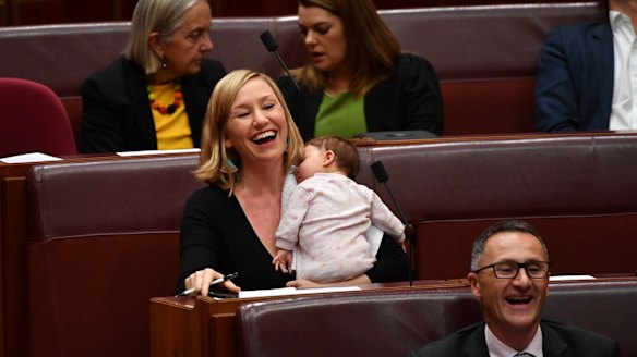 Greens co-deputy leader Larissa Waters soothes baby Alia Joy after breastfeeding her in the Senate.