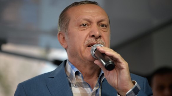 Turkish President Tayyip Erdogan delivers a speech to his supporters in Istanbul after the failed coup.
