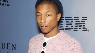 Pharrell Williams says he's happy to be the guy behind the scenes.