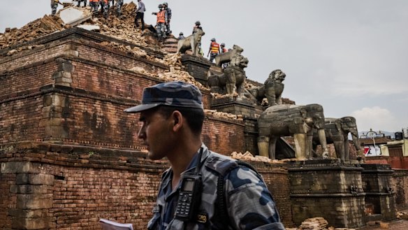 Soldiers clear rubble from a partially collapsed monument in Bhaktapur's Durbar Square.