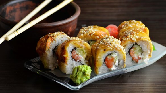 Sushi rolls with ginger and soy sauce. 
