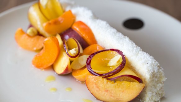 Josh Niland's vanilla coconut cake with stone fruit and green almonds.