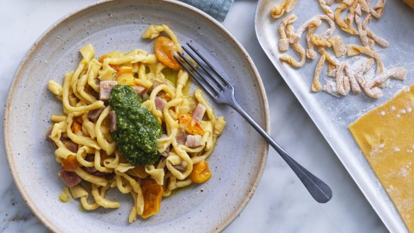 Giovanni Pilu's pasta twists tossed though a tomato sauce with tuna cubes and finished with a dollop of cheese-free pesto.