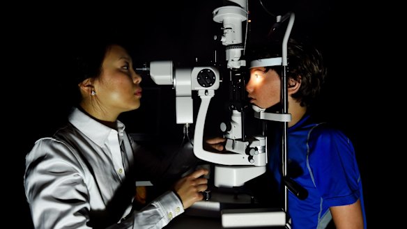 Maxime Jalbert-Locke, right, has an eye examination conducted by Dr Pauline Kang.