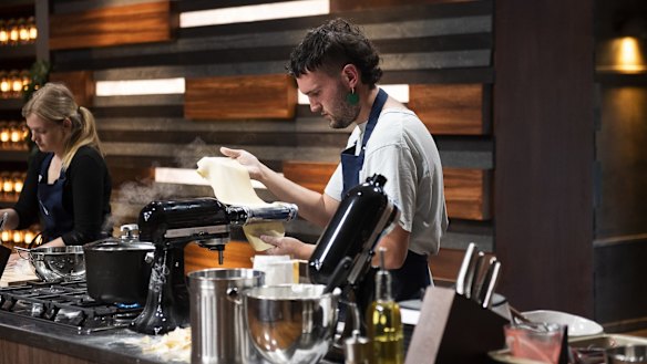 Conor concentrates on his pasta sheet.