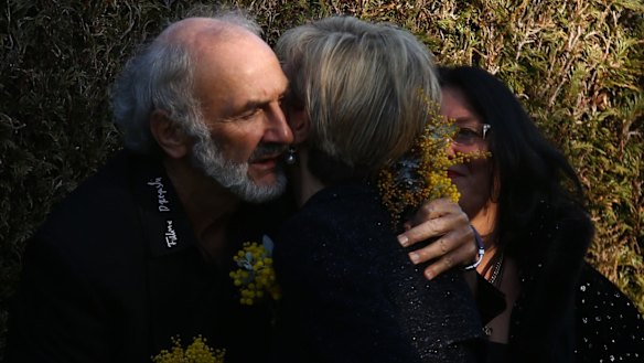 Jerzy Dyczynski, father of MH17 victim Fatima Dyczynski, is hugged by Foreign Minister Julie Bishop at the National Memorial Service in July.