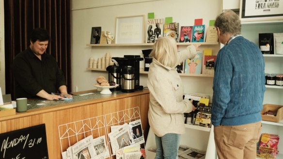 Newspapers and independent magazines join the line-up of pastries and sandwiches at the small shop.