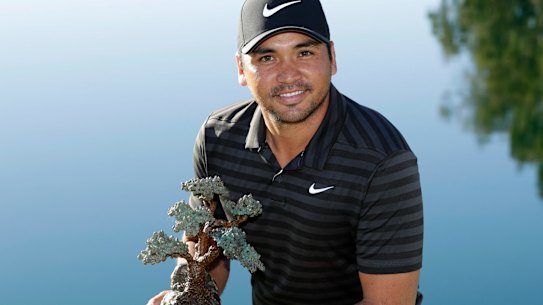 Lofty goal: Jason Day holds the trophy after winning the Farmers Insurance Open.