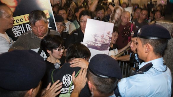Pro-democracy activists clash with police at a security barricade in Hong Kong on Friday.