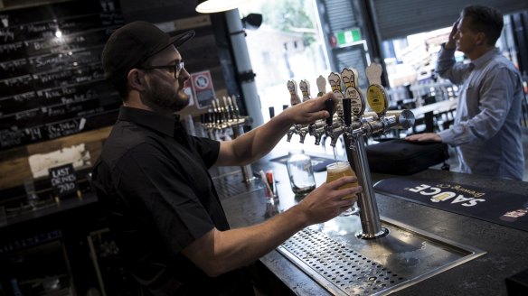 Dave Fitzpatrick pours a beer at Sauce Brewing Co, which is a hit with local families and beer fans.
