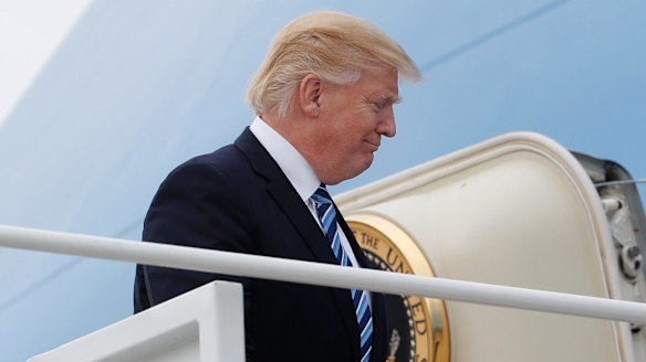President Donald Trump boards Air Force One.