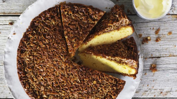 Butter cake with a golden Anzac biscuit topping.