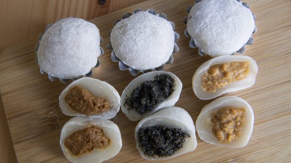 A set of mixed mochi, round and spongy rice desserts.