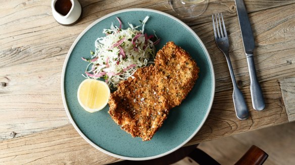 Parmesan-and-herb-crumbed chicken schnitzel.