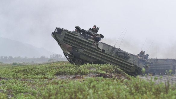 US marines amphibious assault vehicles land on a beach during military exercises with their Philippine marine counterparts in October. Rodrigo Duterte ordered a halt to any joint patrols and naval exercises between the US and the Philippines military including patrols at the disputed South China Sea.