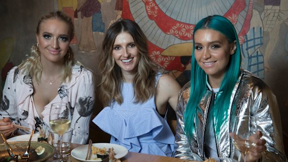 "It was a whirlwind’’: Emma (left) and Amy Sheppard (right) with Kate Waterhouse at Tokonoma.