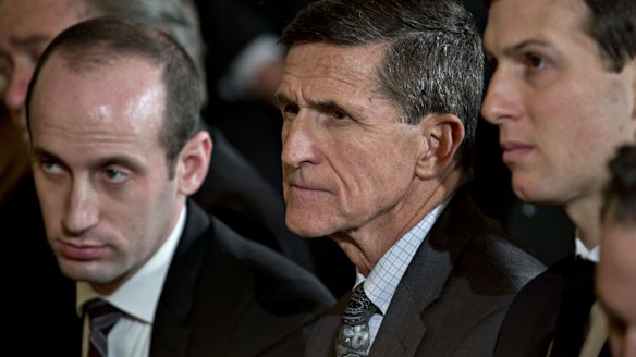 Michael Flynn, former US national security adviser, centre and Jared Kushner, senior White House adviser, right.