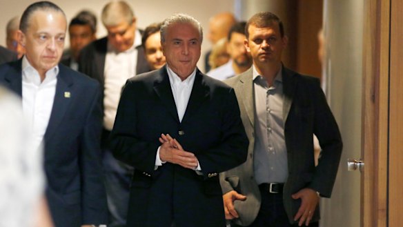 Michel Temer arrives to deliver his new statement, in which he called leading Brazilian businessman Joesley Batista a 'criminal' and a 'windbag'.