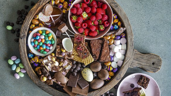 Fresh berries, chocolate-dipped wafers and portions of chocolate cake and rocky road add visual interest to this chocolate grazing platter.