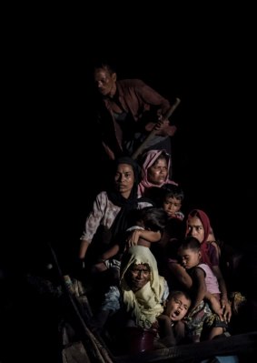 Rohingya refugees after crossing the Naf River from Myanmar, near the village of Shah Porir Dwip, Bangladesh.