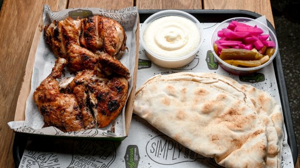 Whole chicken plate with pickles, pita and toum (tangy garlic sauce).