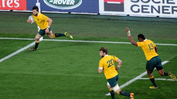 Ball game: Adam Ashley-Cooper crosses for his third try of the match after Drew Mitchell's pass.