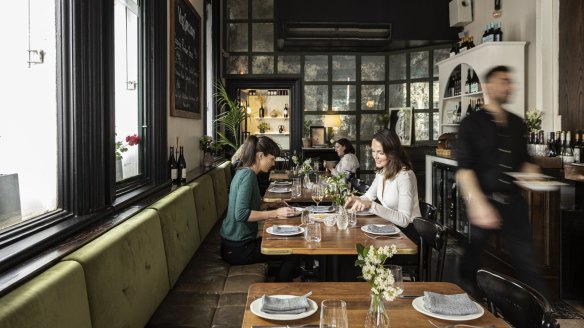 Moss-green banquettes inside Richmond's charming Tartine.