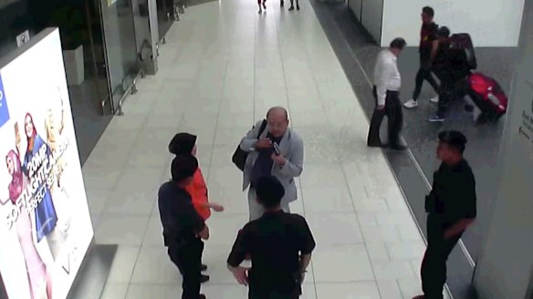 CCTV footage shows Kim Jong-nam speaking with Kuala Lumpur airport officials after the attack.