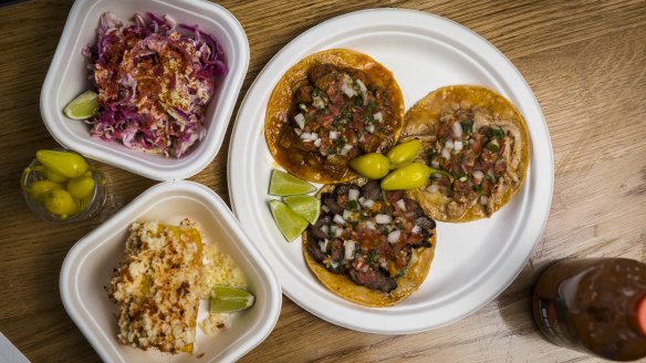 The taco plate with two sides, corn and slaw.