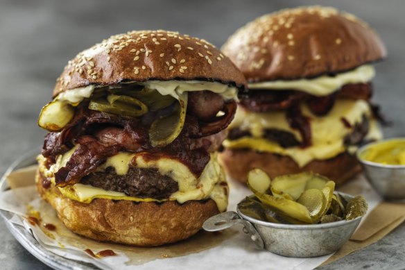 Towering triple cheese and bacon burgers.