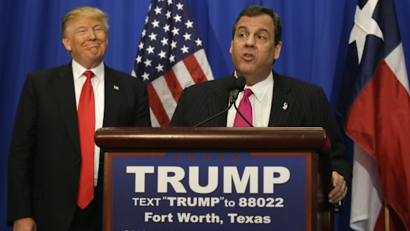 Republican presidential candidate Donald Trump smiles as he stands with New Jersey Governor Chris Christie before a rally in Fort Worth, Texas, on Friday.