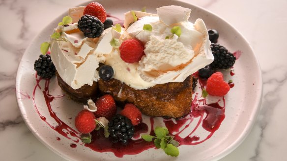 Fried brioche is bejewelled with fresh berries and vanilla meringue.