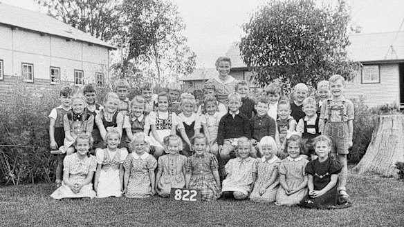 Teacher Mrs Gudrun Heide with her class at Camp 3, in March 1945. 